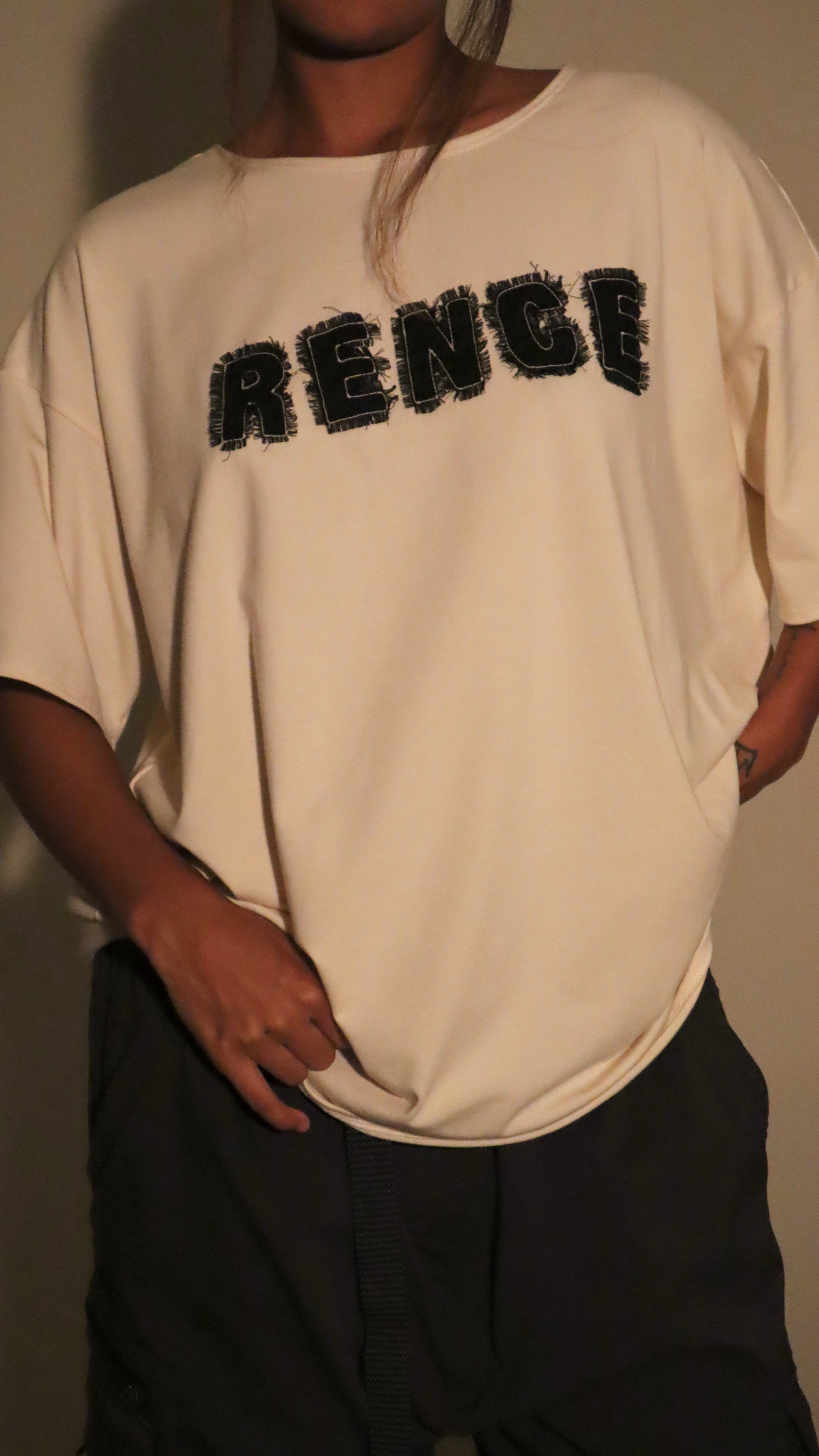 Beige Oversized scrap Tee.